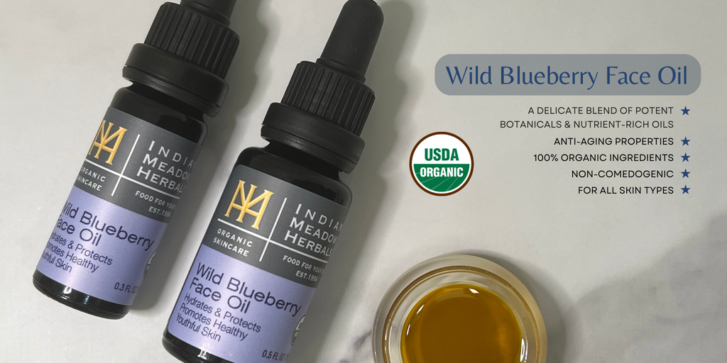 Two sizes of Wild Blueberry Face Oil and a top view of the oil.