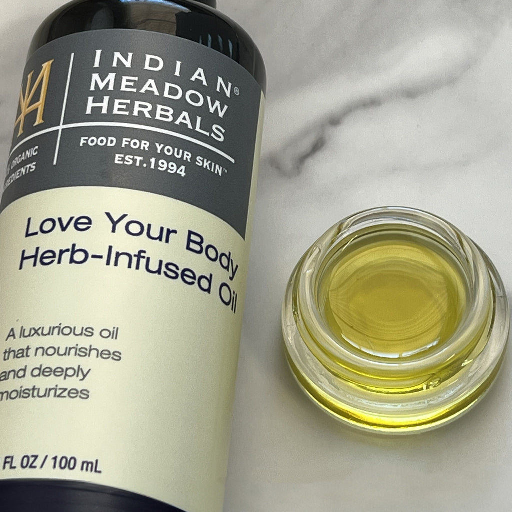 3.4 oz. Love Your Body Herb-Infused Oil with close-up of oil