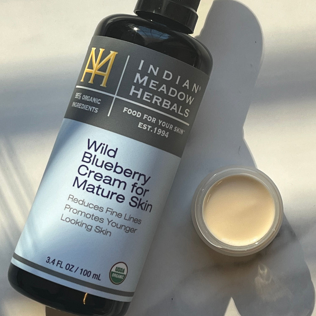 Lifestyle image of Wild Blueberry Cream for Mature Skin with a close-up of the cream