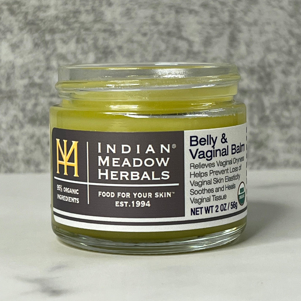 Front view of an open jar of Belly & Vaginal Balm